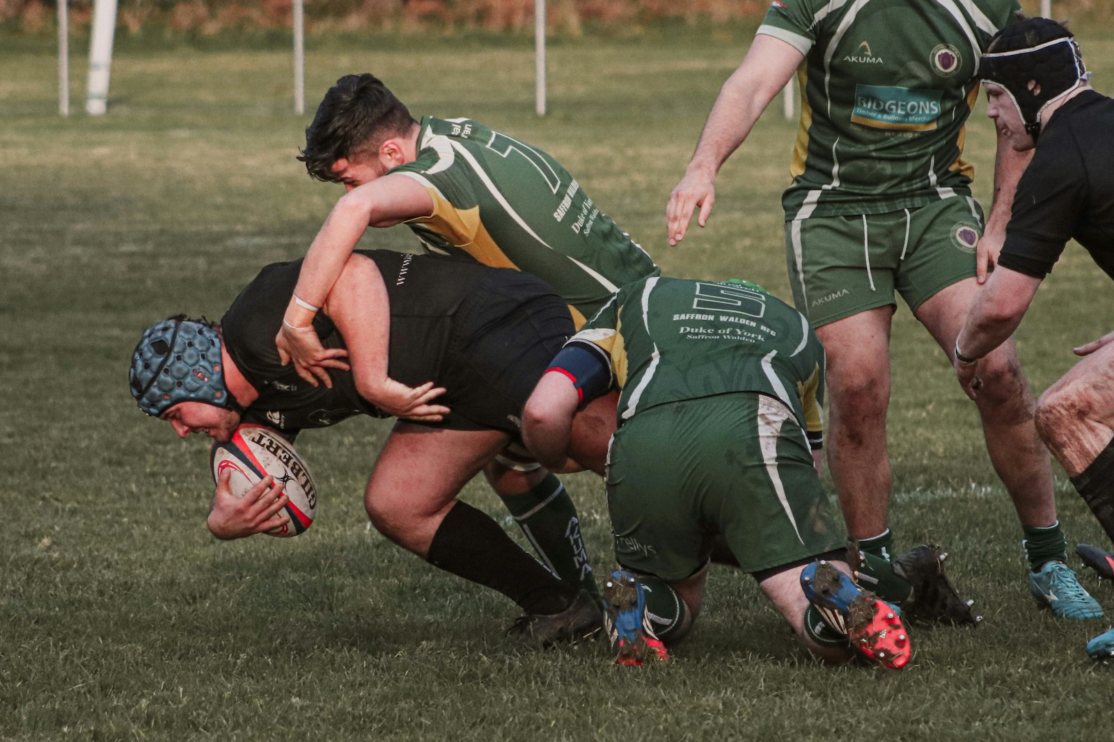 Rugby players tackling during a club match
